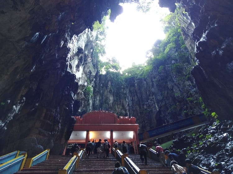 The Batu Caves cliff has a small opening above from where the sky can be see